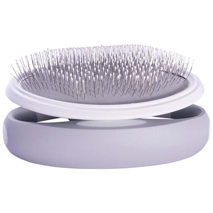 The Pet Life 'Gyrater' Travel Swivel Pet Brush is compact and perfect for travel, featuring customizable grip options and gentle, flexible bristles. - Wolldi