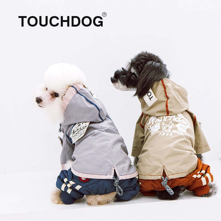 The Touchdog 'Cloudburst' Waterproof Reversible Dog Raincoat is adjustable, waterproof, and stylish. - Wolldi