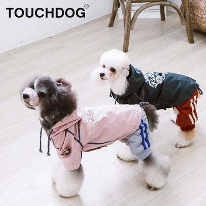 The Touchdog 'Cloudburst' Waterproof Reversible Dog Raincoat is adjustable, waterproof, and stylish. - Wolldi