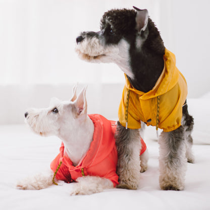 The Touchdog Split-Vent Designer Waterproof Dog Raincoat is a stylish and adjustable raincoat with reflective stitching for night visibility. - Wolldi