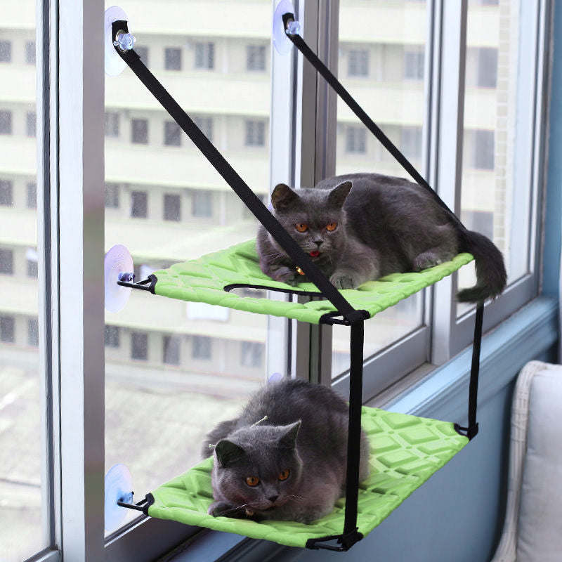 The Cat Laze is a suction cupped dual-leveled cat lounger that saves space. - Wolldi
