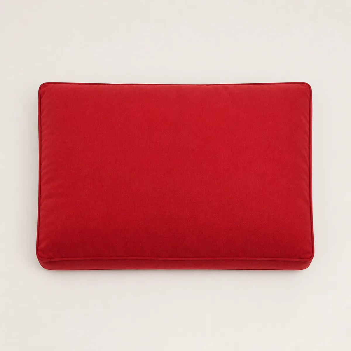 Red rectangular dog bed viewed from above